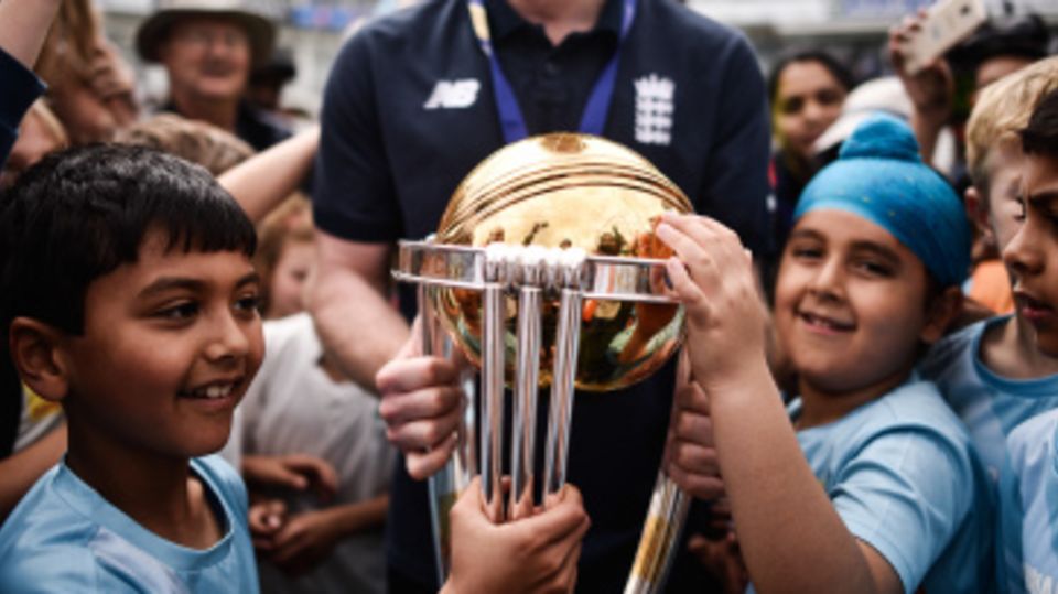 Eoin Morgan gives young fans an opportunity to get up close with the World Cup trophy