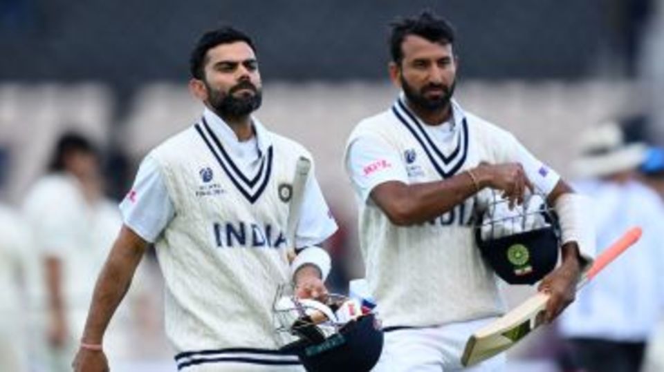 Cheteshwar Pujara and Virat Kohli walk back at stumps on Day 5 of the WTC final