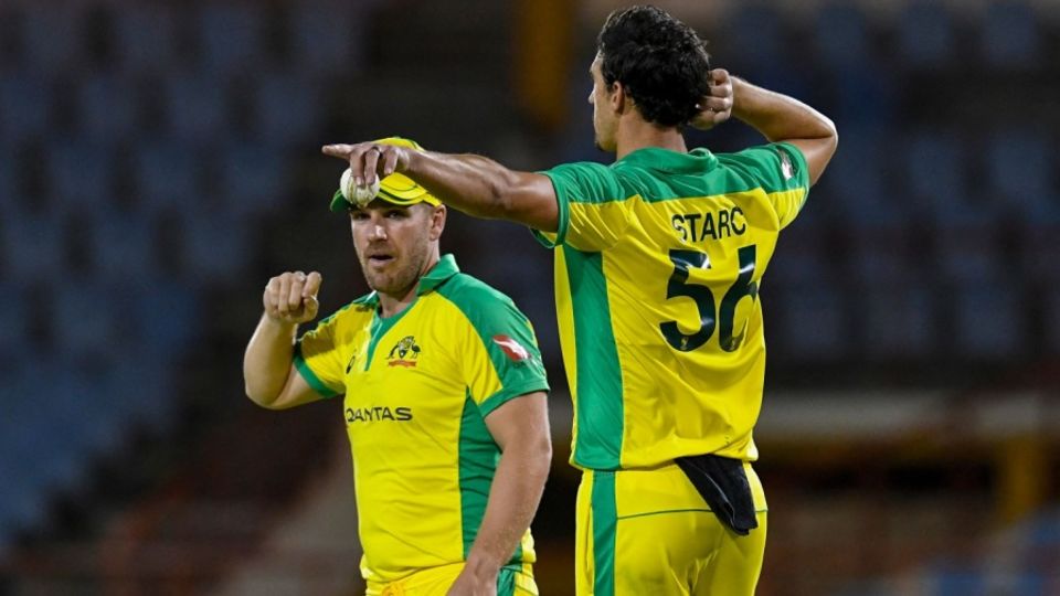 Aaron Finch and Mitchell Starc have a chat