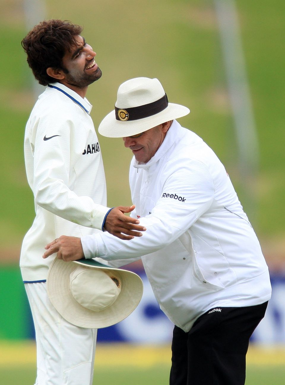 Umpire Daryl Harper gives Munaf Patel a pat-down after the ball goes missing on the final day of the Test in Wellington in 2009