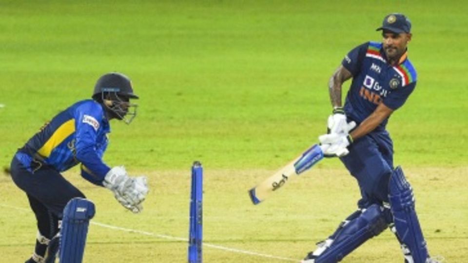 Shikhar Dhawan tries to sweep as Minod Bhanuka looks on