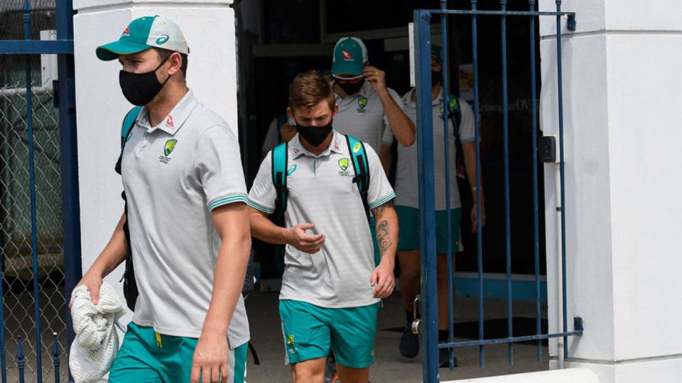 Australian players leave the ground after the match was called off