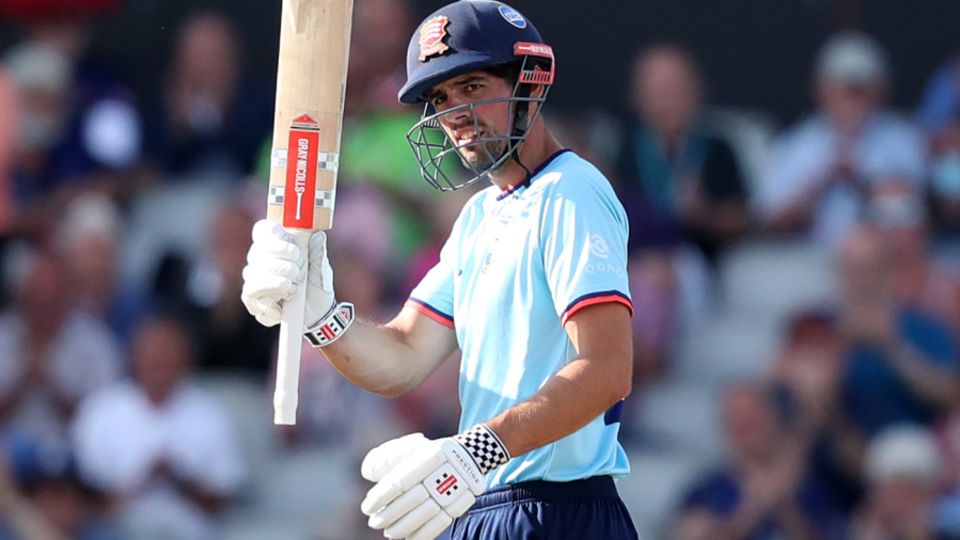 Alastair Cook raises his bat on reaching three figures