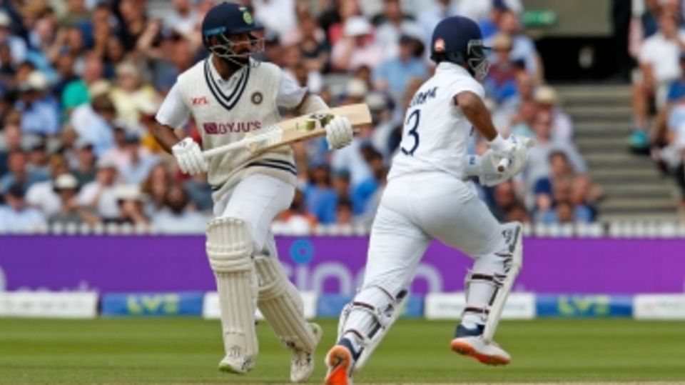 Ajinkya Rahane and Cheteshwar Pujara cross for a run