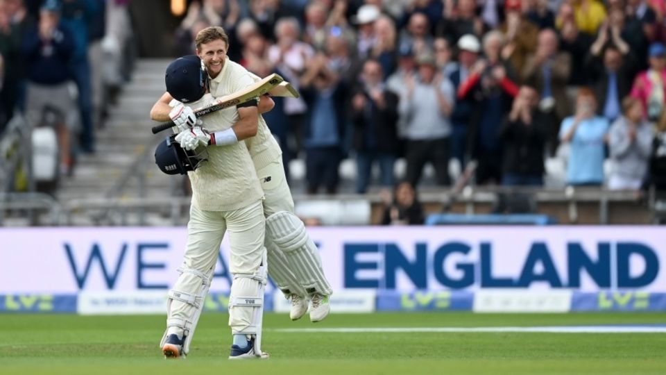 Joe Root is embraced by Jonny Bairstow after reaching his hundred