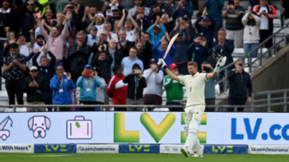 Joe Root acknowledges the cheers as he goes back