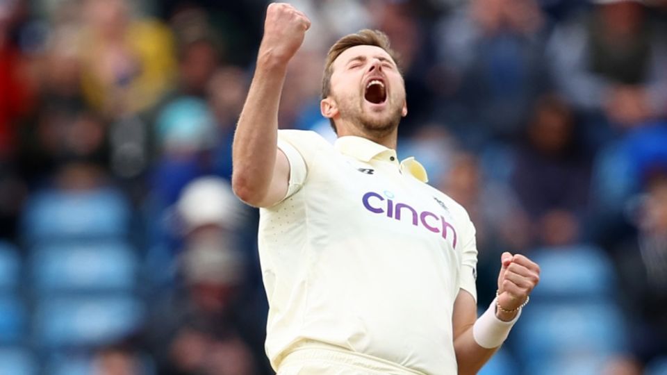 Ollie Robinson exults after dismissing Rohit Sharma