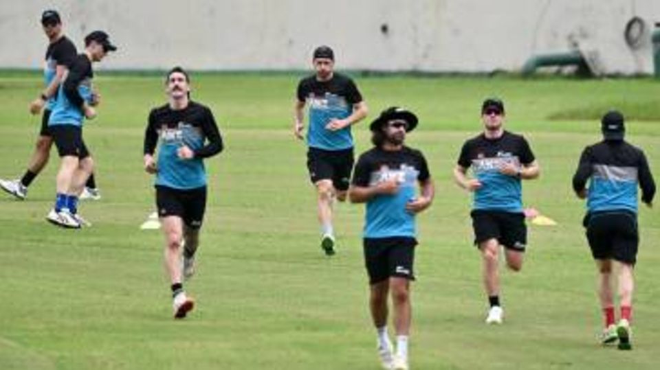New Zealand's players warm up during a practice session
