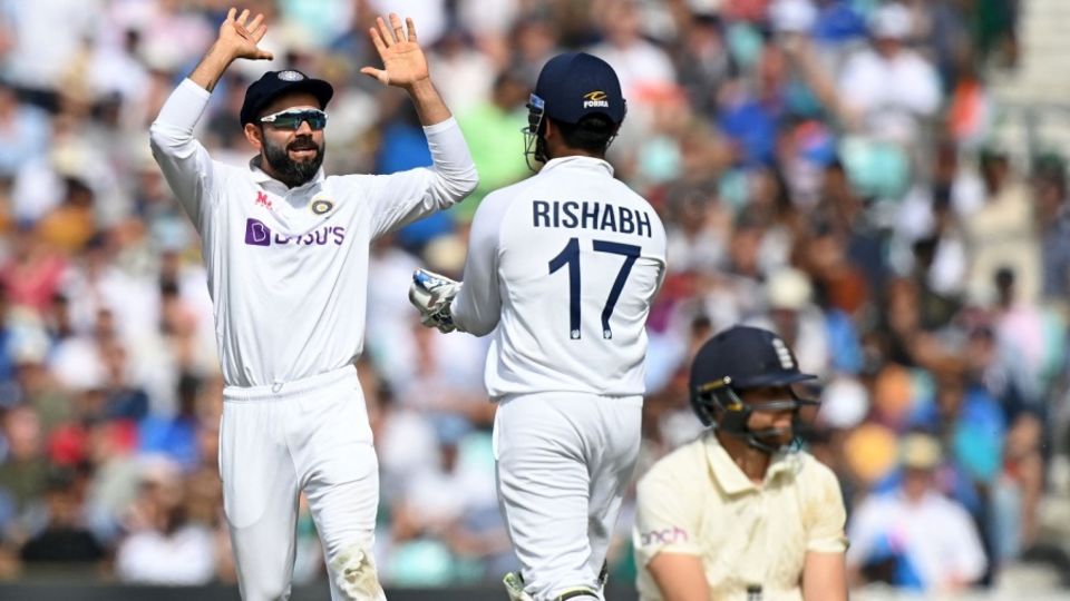 Dawid Malan after being run-out, as Virat Kohli and Rishabh Pant celebrate