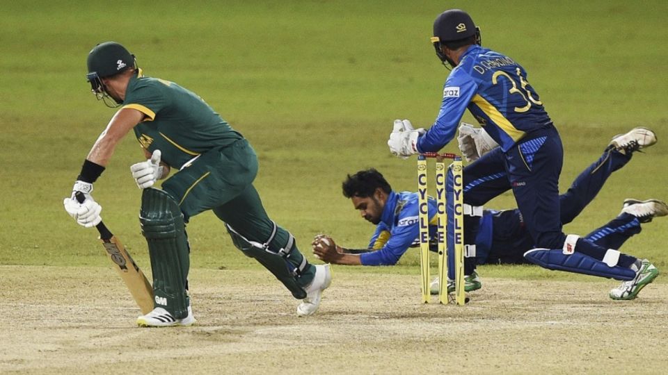 Dhananjaya de Silva hangs onto a sharp catch to dismiss Aiden Markram
