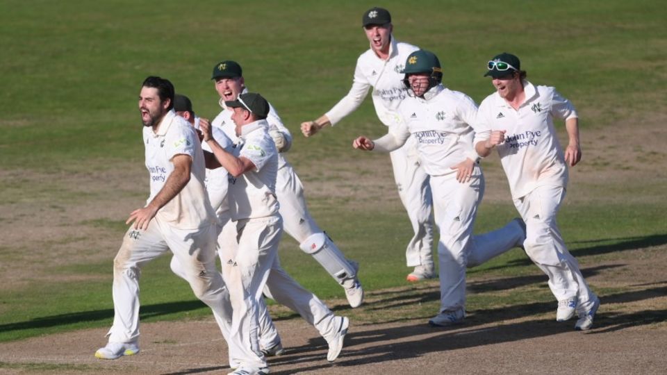 Brett Hutton is mobbed after claiming the decisive wicket of Saqib Mahmood