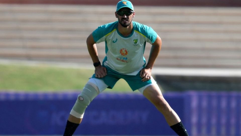 Mitchell Starc with a compression bandage on his bruised knee