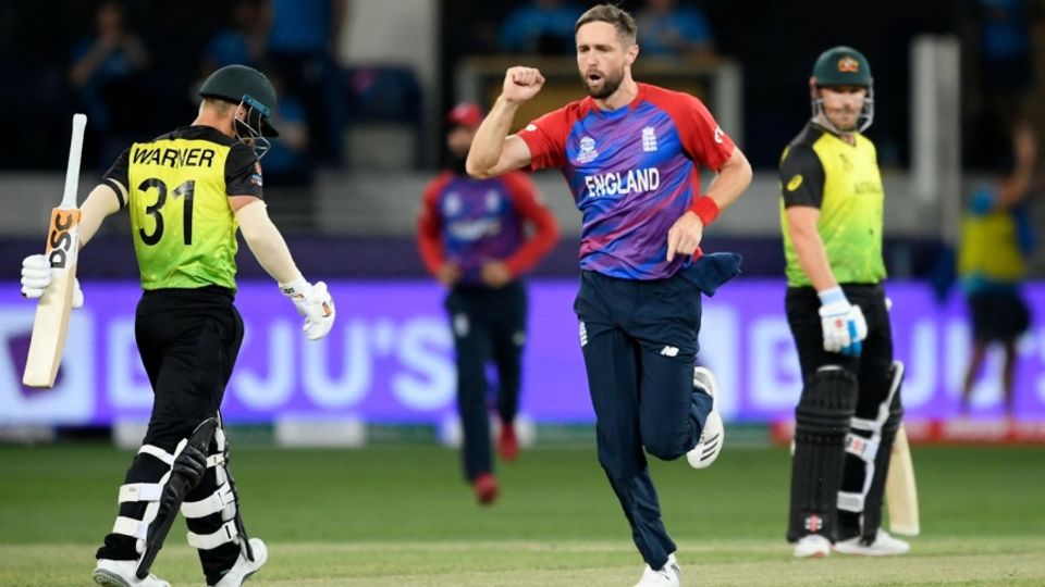 Chris Woakes sends back David Warner