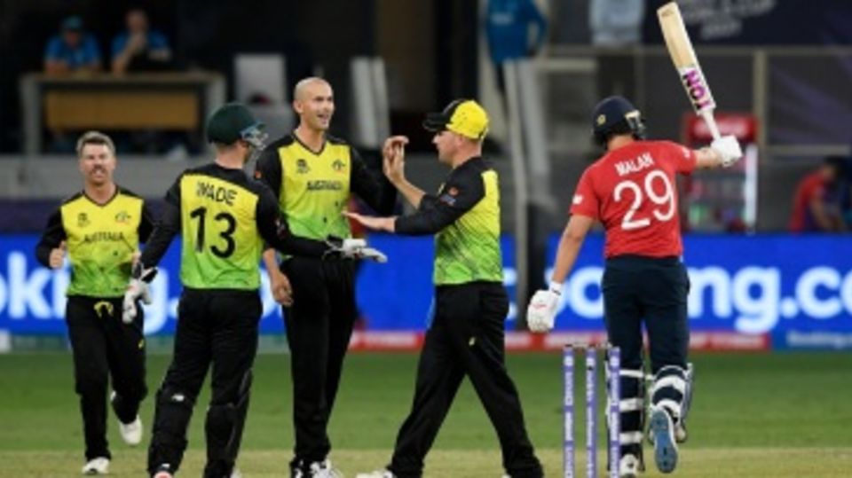 Ashton Agar celebrates with his team-mates after dismissing Dawid Malan