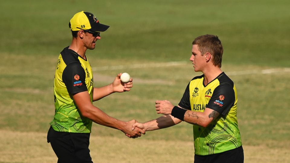 Mitchell Starc hands the match ball over to Adam Zampa