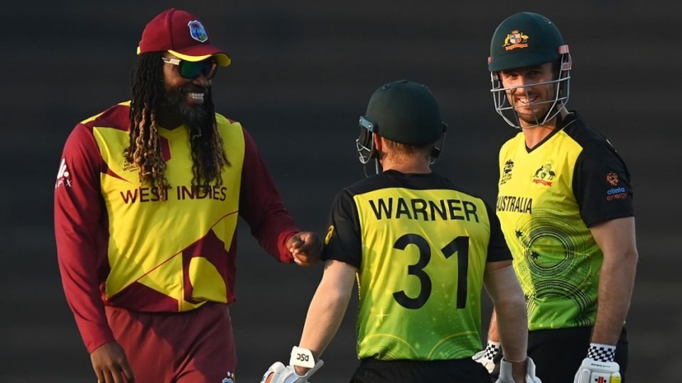 Chris Gayle, Mitchell Marsh and David Warner share a light moment on the field