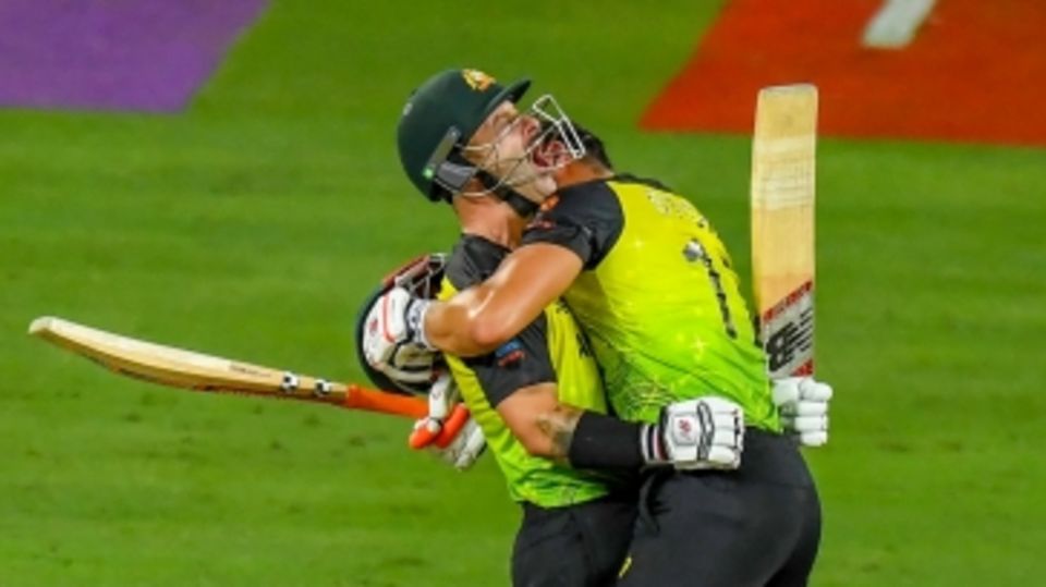 Matthew Wade roars - and gets a bear hug from Marcus Stoinis - after hitting 6, 6, 6, to get Australia home