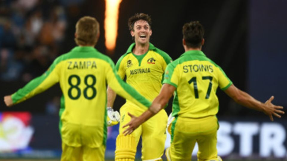 Mitchell Marsh runs towards Adam Zampa and Marcus Stoinis to celebrate the win