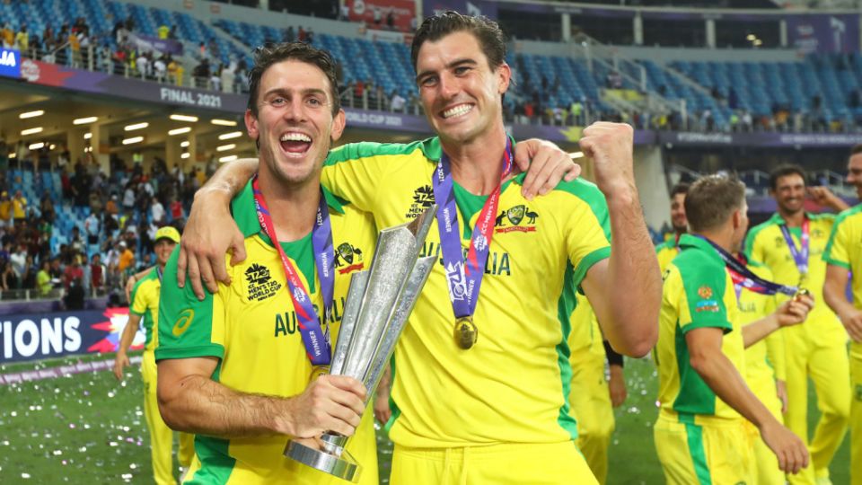 Mitchell Marsh and Pat Cummins celebrate with the trophy