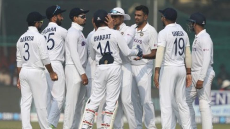 R Ashwin celebrates with team-mates the dismissal of Will Young