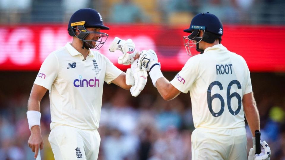 Dawid Malan and Joe Root punch gloves at the end of the third day's play