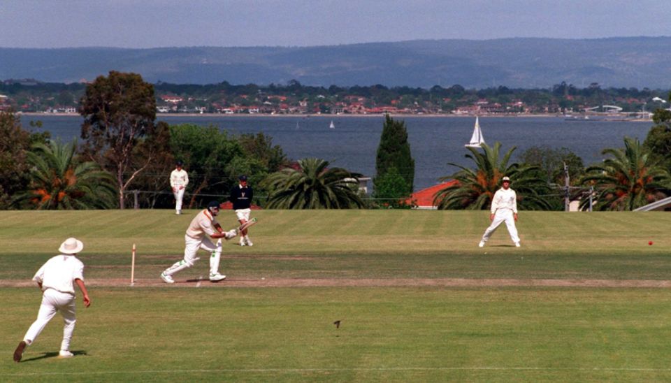 Graeme Hick bats in a practice match at a ground overlooking the Swan River in Perth, 1994