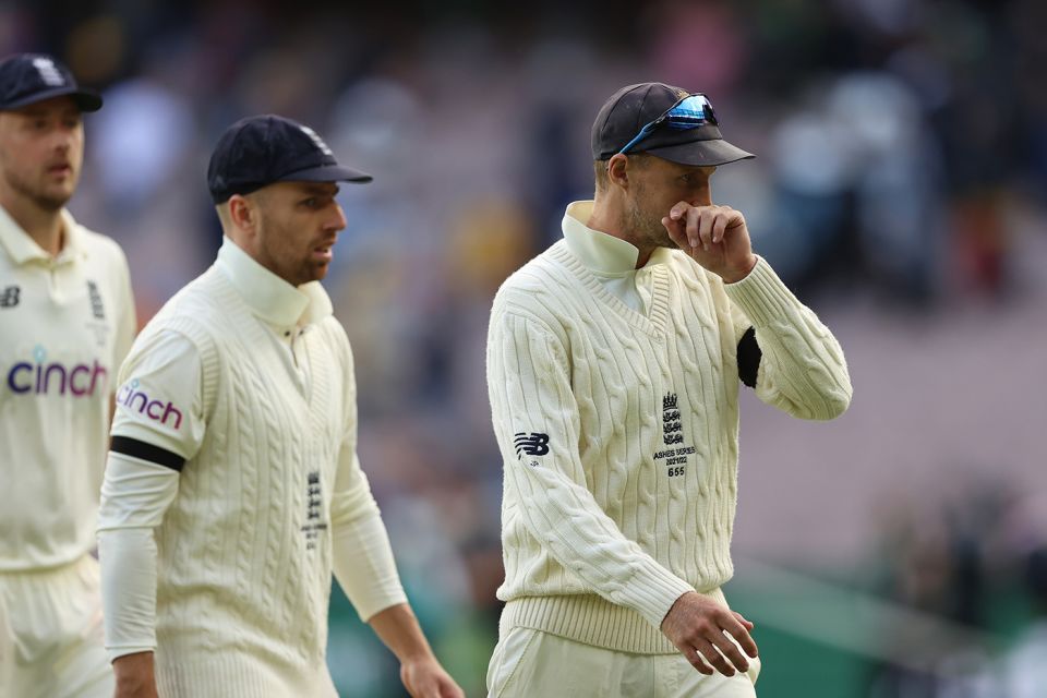 Joe Root leads his players off after another tough day