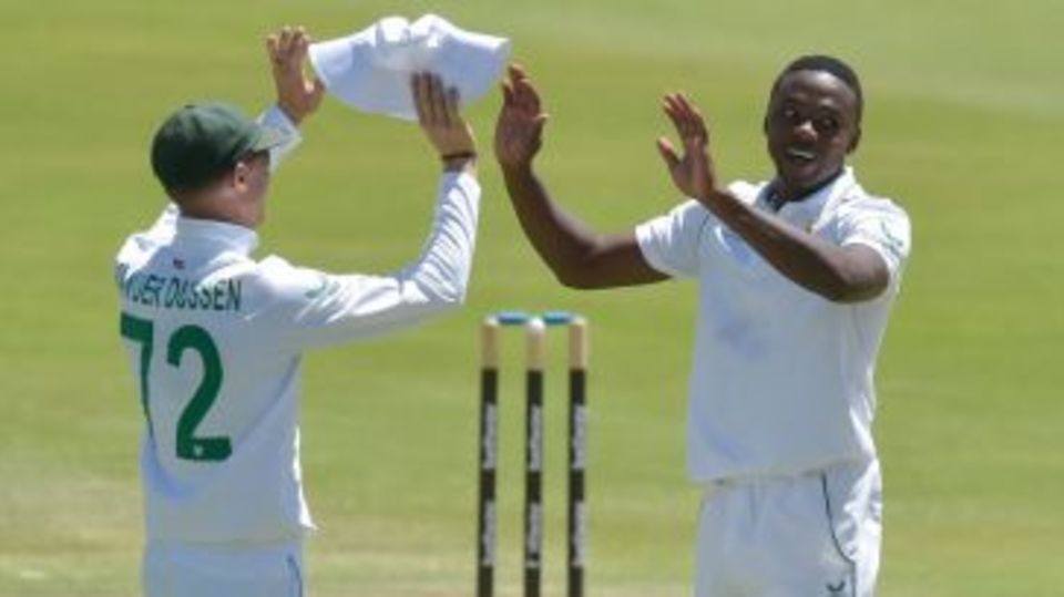 Kagiso Rabada gets a high-five from Rassie van der Dussen