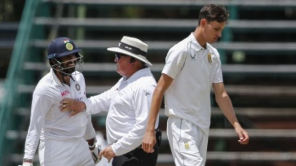 Umpire Marais Erasmus gets in the way of Jasprit Bumrah (L) and Marco Jansen after a mid-pitch confrontation between the players