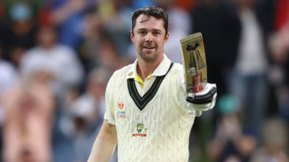 Travis Head celebrates his hundred