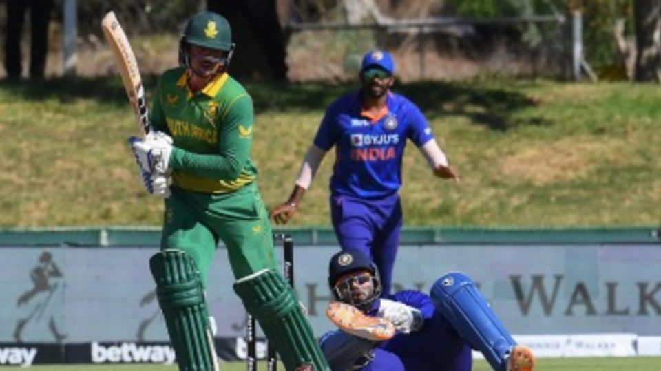 Quinton de Kock plays a shot as Rishabh Pant loses his footing