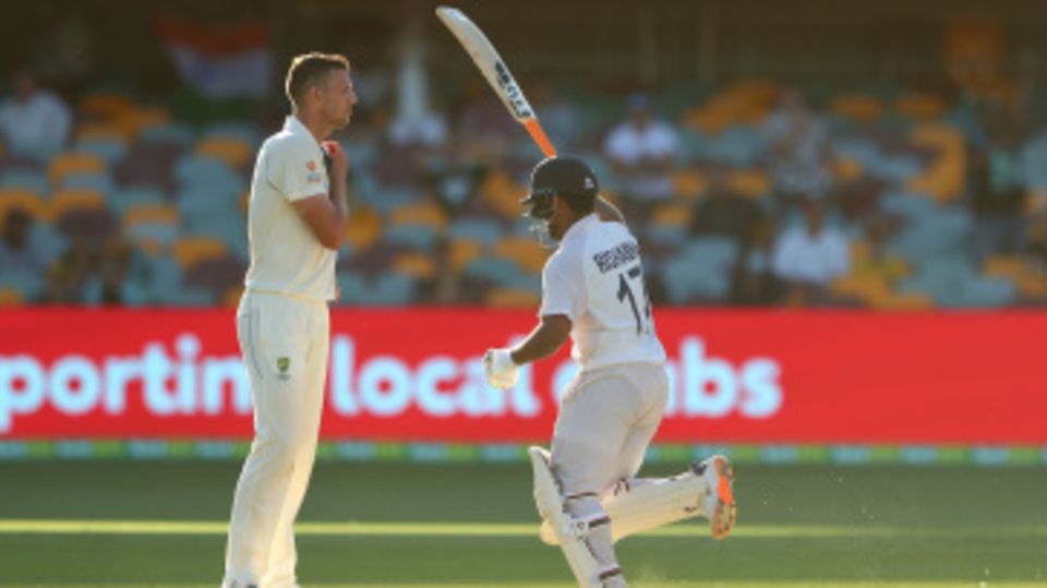 Rishabh Pant celebrates victory while Josh Hazlewood looks on dejectedly