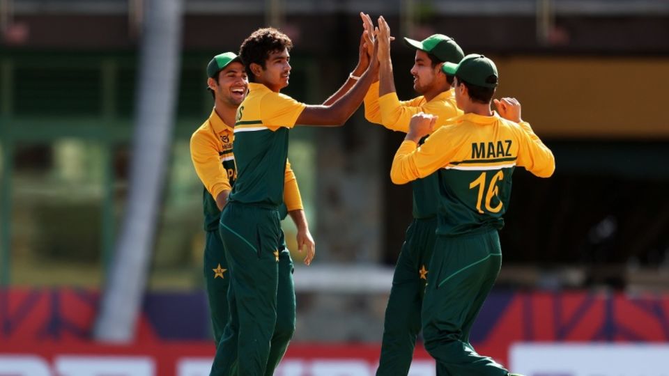 Awais Ali celebrates a wicket with team-mates against Bangladesh