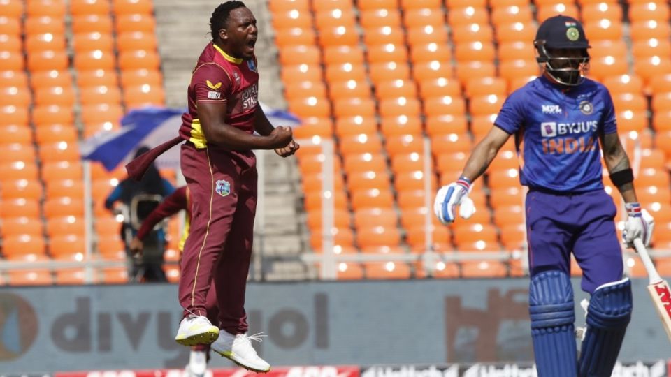 An elated Odean Smith jumps after snaring Virat Kohli