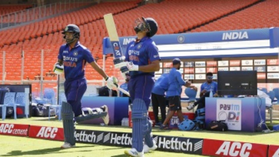 Shikhar Dhawan and Rohit Sharma stride out to open