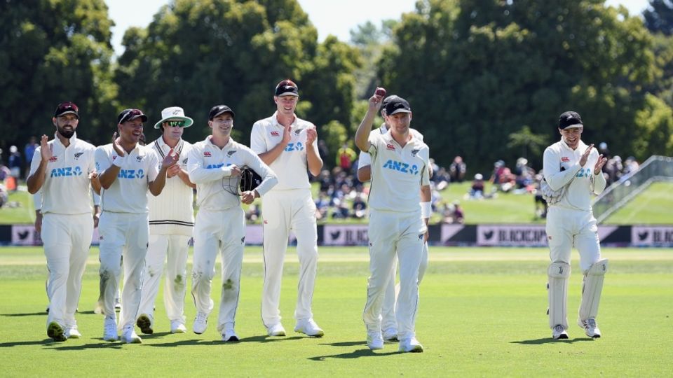 Matt Henry is applauded by his team-mates as he walks off