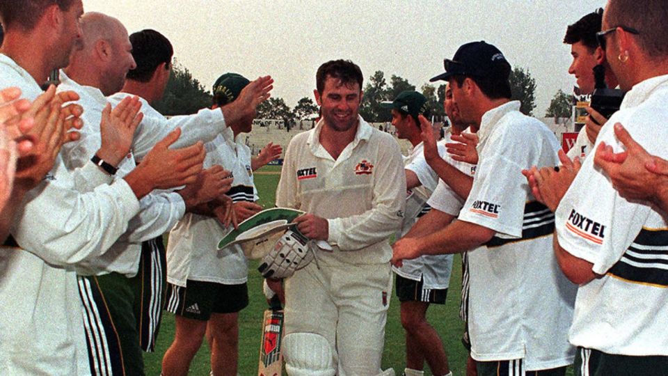 Mark Taylor is given a guard of honour as he leaves the field unbeaten on 334