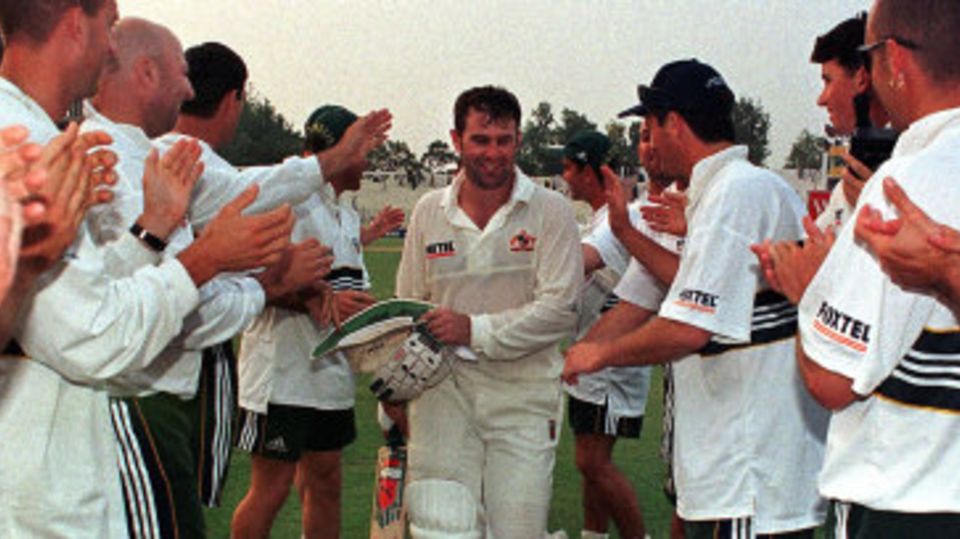 Mark Taylor is given a guard of honour as he leaves the field unbeaten on 334