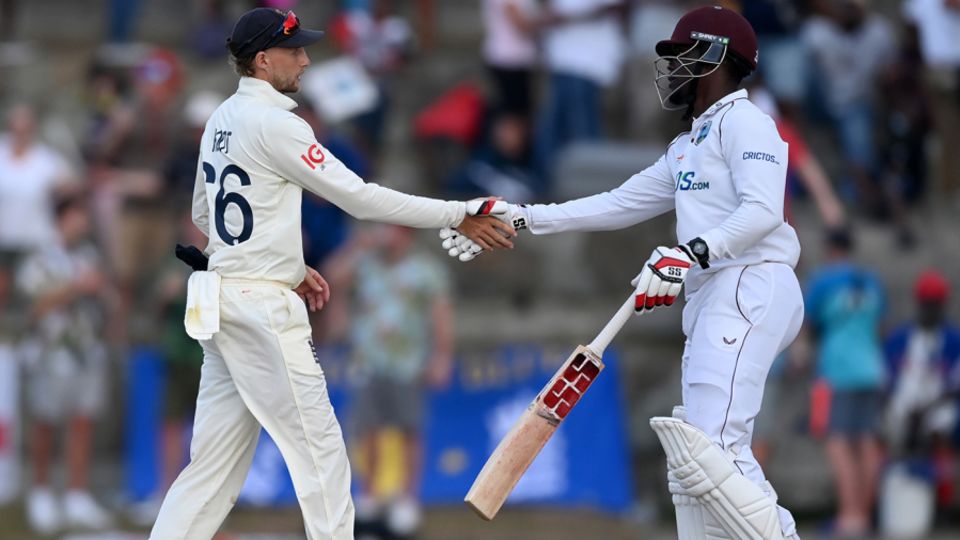Joe Root and Nkrumah Bonner shake hands on the draw