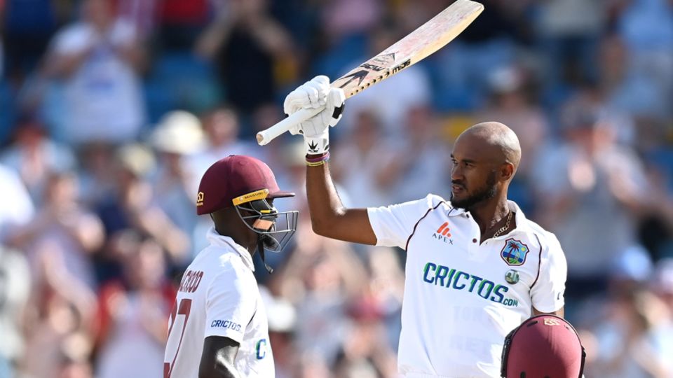 Kraigg Brathwaite raises his bat on reaching his hundred