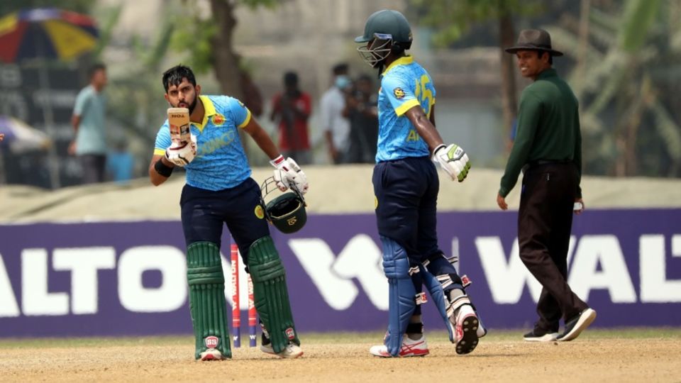 Shamim Hossain celebrates his century