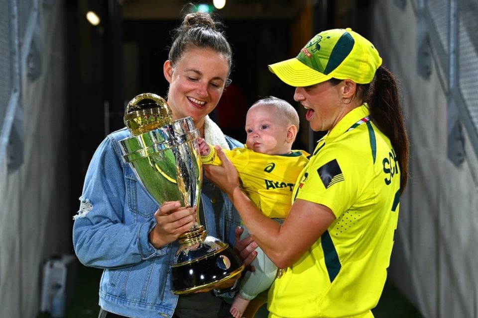 Schutt, right, with her partner Jess Holyoake and their daughter Rylee, after the 2022 T20 World Cup win