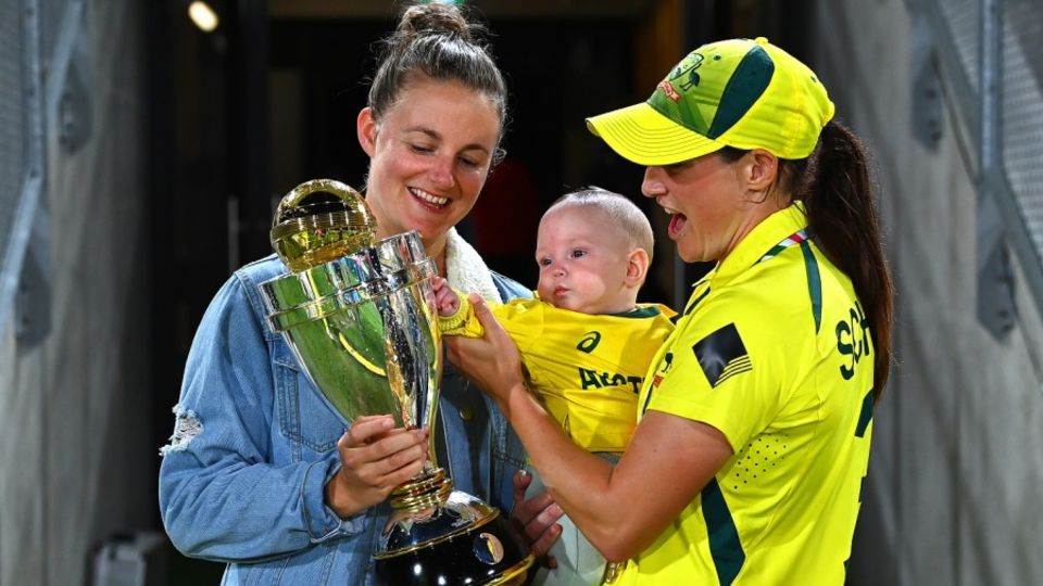 Schutt celebrates the 2022 World Cup win with her wife and daughter