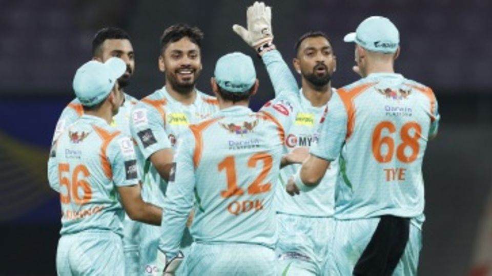 Avesh Khan is mobbed by his team-mates after producing a double-strike
