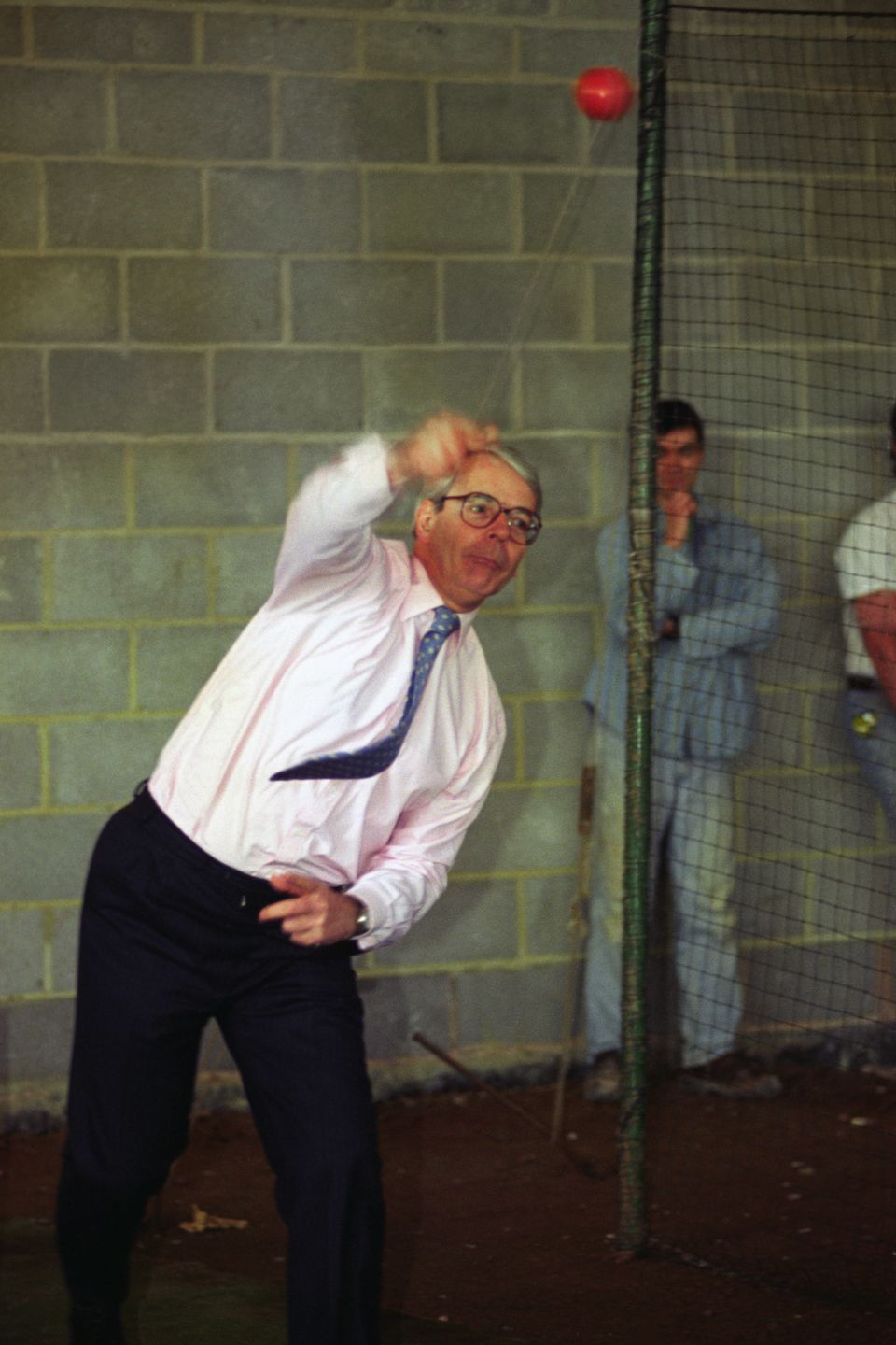 John Major bowls in the nets at Somerset cricket club's indoor cricket school at Taunton in 1995