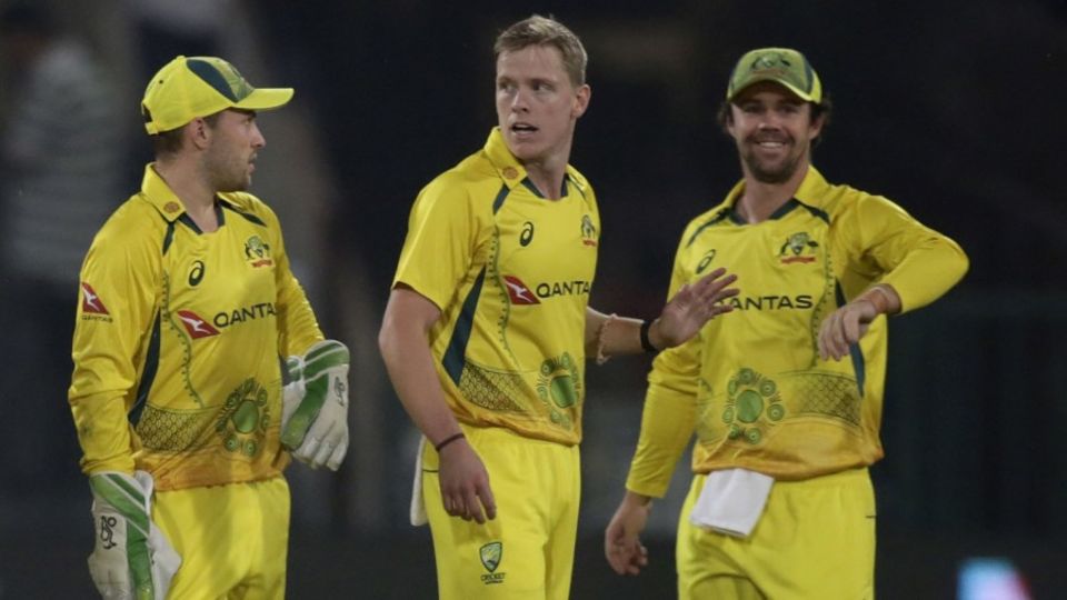 Nathan Ellis celebrates a wicket with Josh Inglis and Travis Head