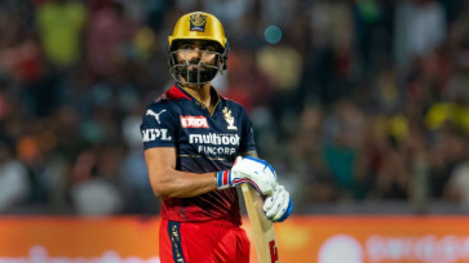 A dejected Virat Kohli walks back to the pavilion