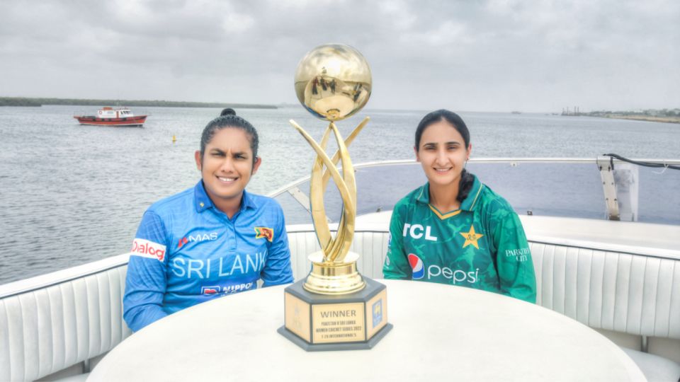 Chamari Athapaththu and Bismah Maroof pose with the T20I series trophy on a yacht off the Karachi coast