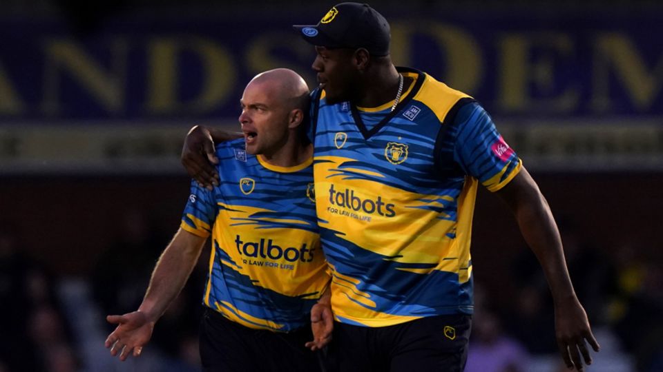 Jake Lintott gets a hug from Carlos Brathwaite