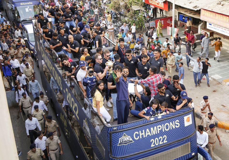 Hardik Pandya with his Gujarat Titans team-mates on an open-top-bus parade after winning the 2022 title